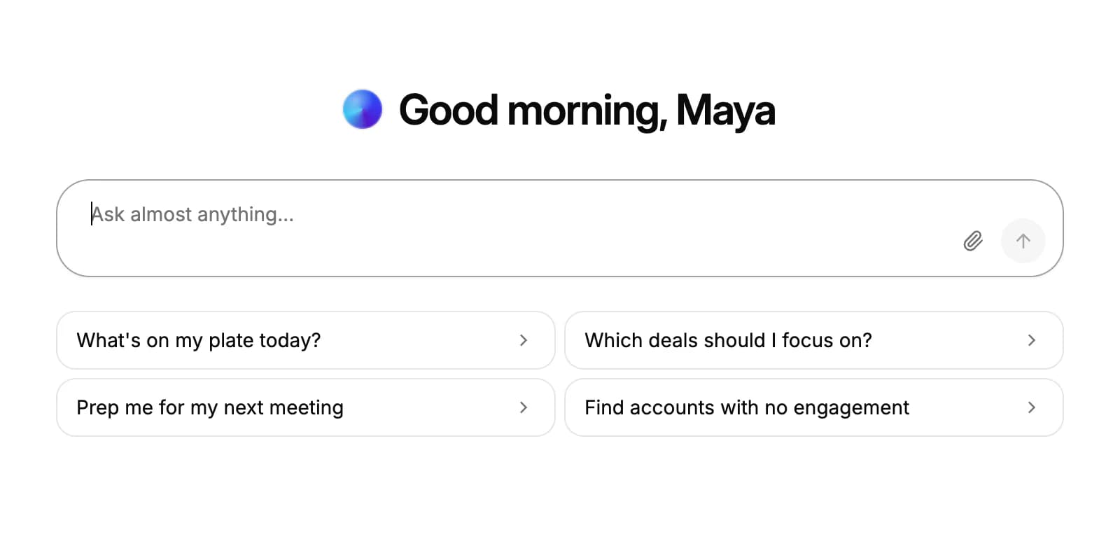 The Ask AI chat page: a greeting, the message box with an attach button, and four suggested questions