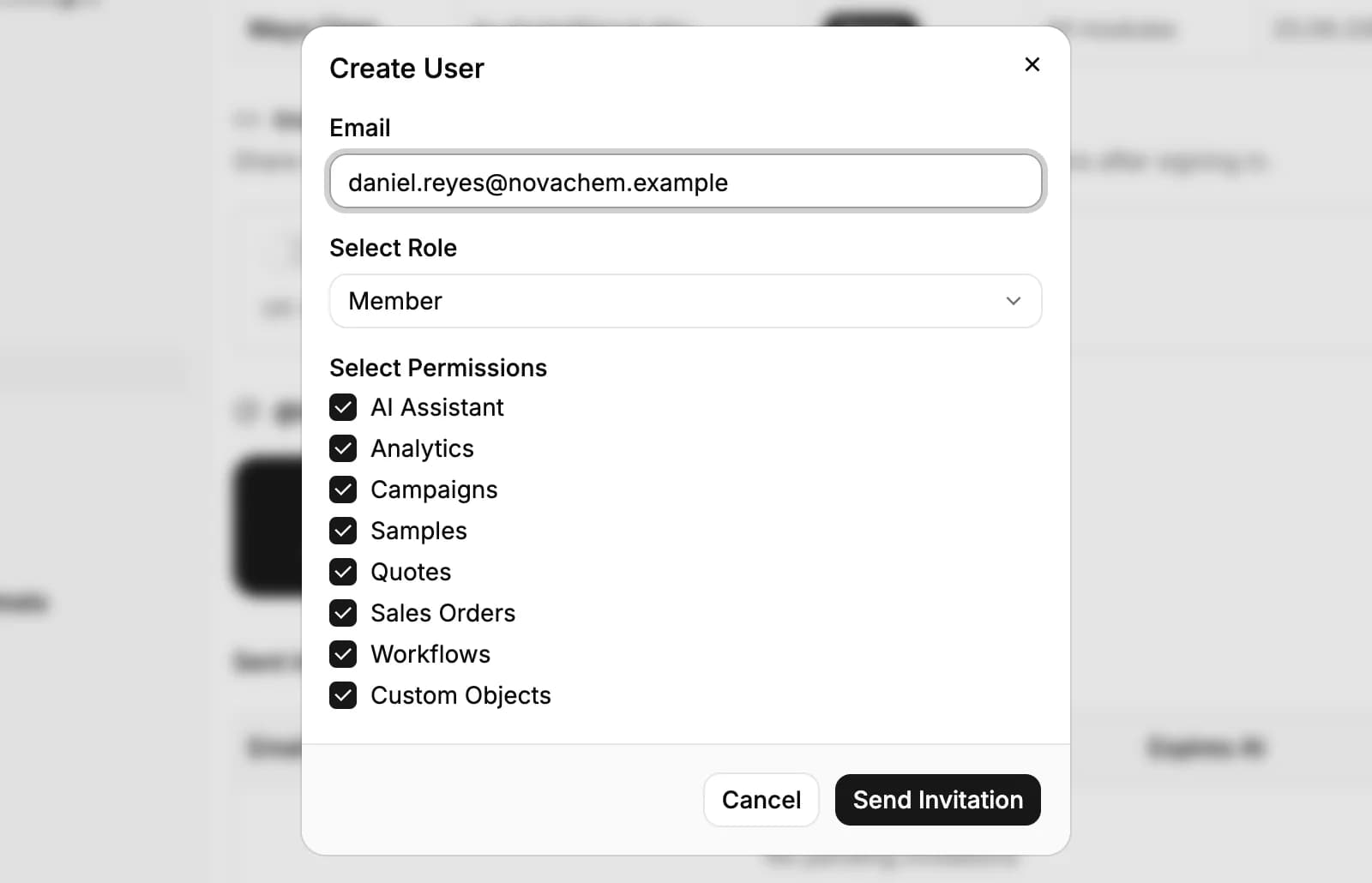 The Create User dialog: an email address, the role set to Member, and the module permissions ticked, with Send Invitation