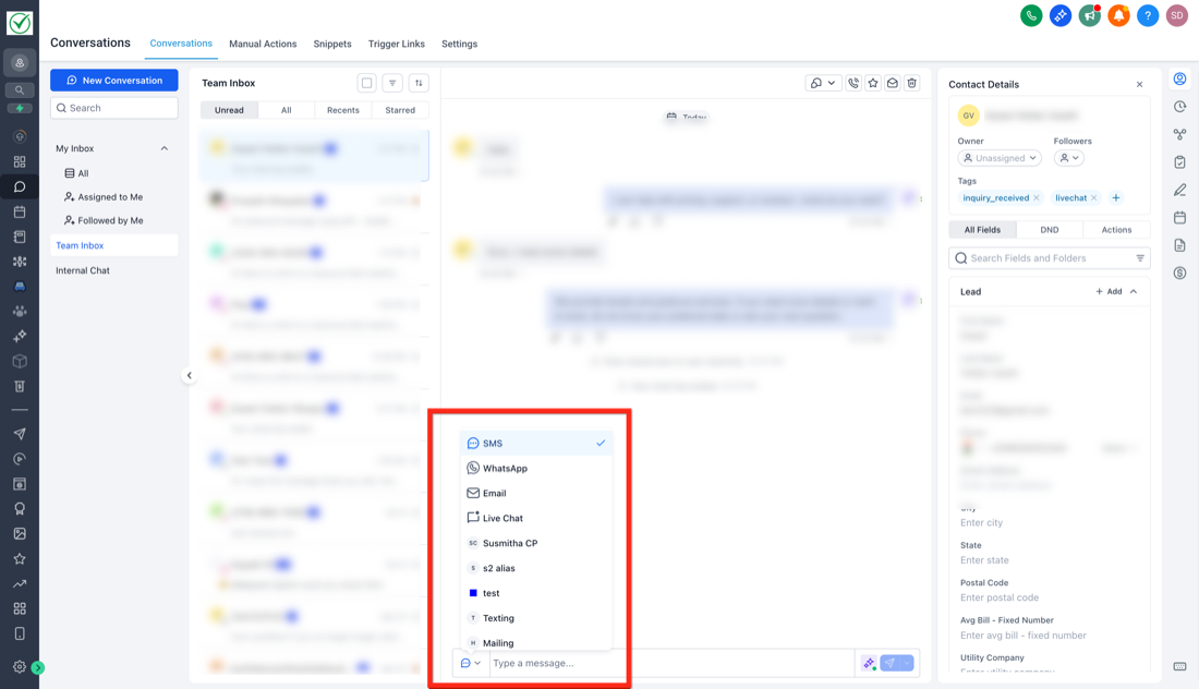 HighLevel's Team Inbox with the reply channel menu open: SMS, WhatsApp, Email and Live Chat